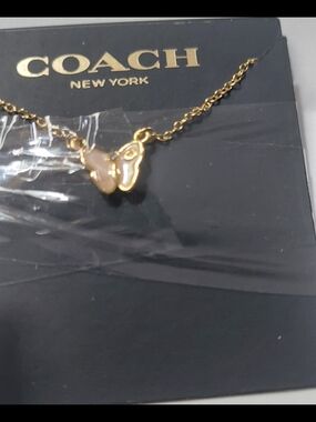 Coach Gold Butterfly Necklace with Pale Pink Accent
